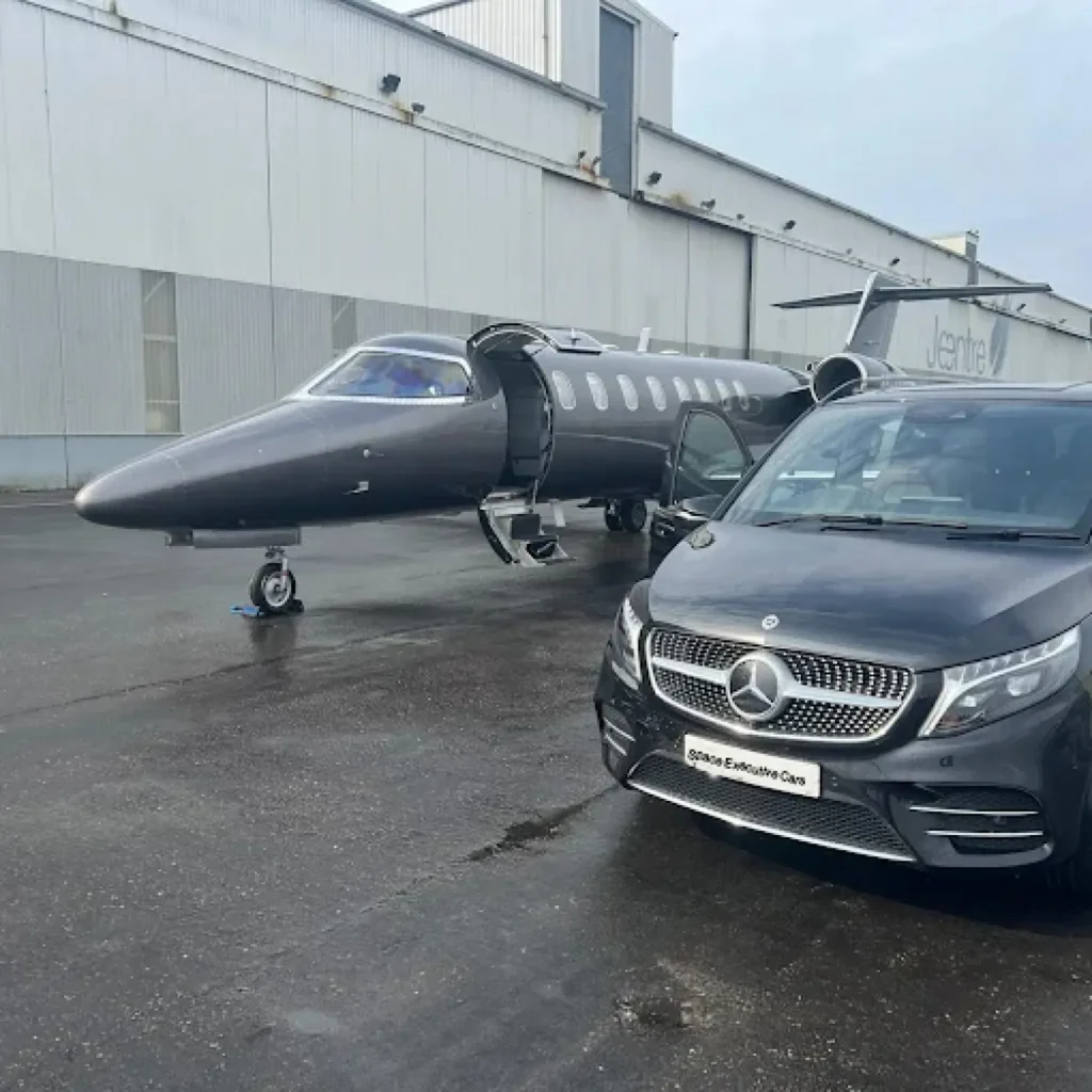 Professional chauffeur driving luxury vehicle